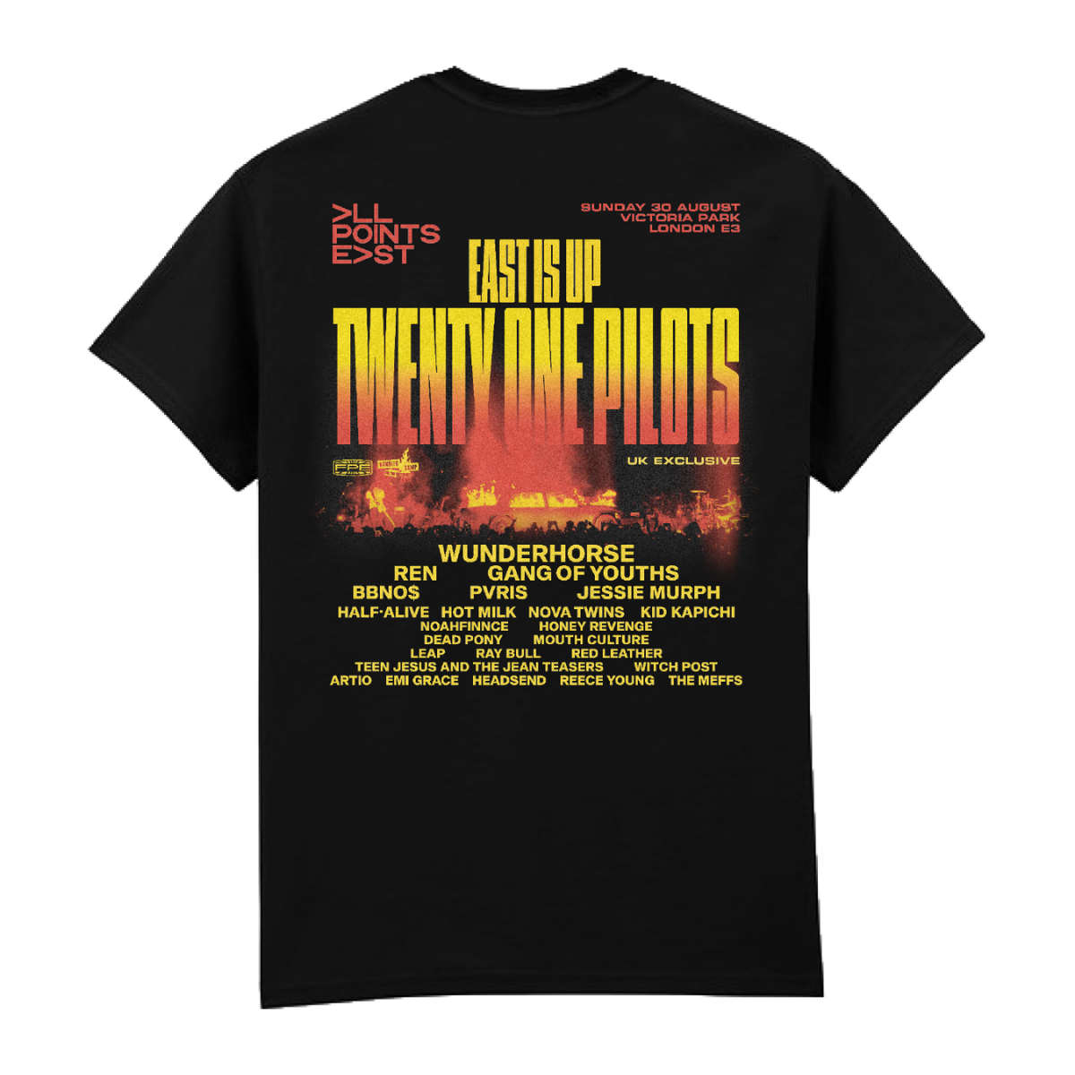 PRE-ORDER: All Points East 2026 Twenty One Pilots Event T-Shirt by All Points East—a black tee with “EAST IS UP TWENTY ONE PILOTS” printed in yellow and red on the front, available at the main merchandise stand. The back features the festival lineup and details in yellow and white text, set against a backdrop of city and fire graphics.