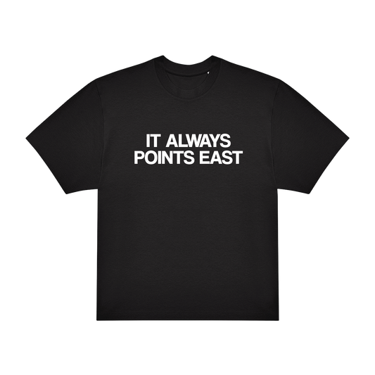The 2025 Its Always Points East T-Shirt is a black tee featuring IT ALWAYS POINTS EAST in bold white capital letters on the front.